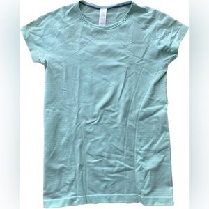 This short sleeve shirt is from the discontinued brand Ivivva. It’s a size 14.